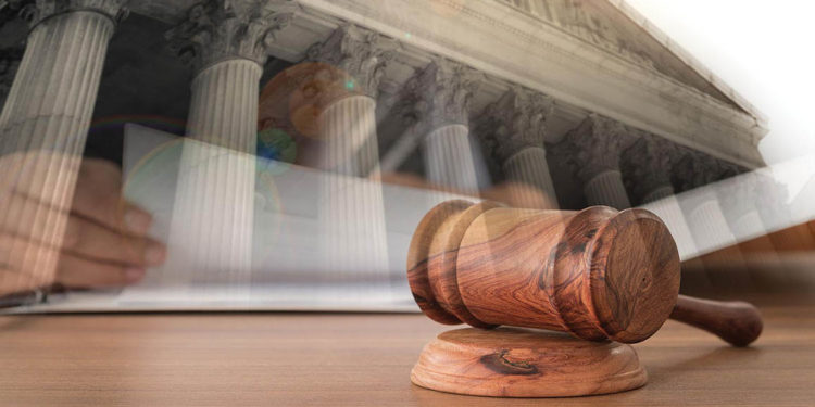 Gov. Stitt Named Among Defendants in Class Action Suit