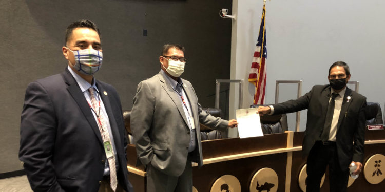 MCN Principal Chief David Hill (Far Right) MCN National Council Speaker Randall Hicks (Center) and MCN Second Chief Dell Beaver are pictured holding a freshly affirmed “Independent Mvskoke (Creek) Press law on July 23. (Photo by Angel Ellis)