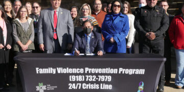 Principal Chief Hill signs the “Victim Protection and Jurisdiction Expansion Act.”