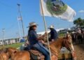 Bristow community chairwoman carries the Muscogee flag at rodeo
