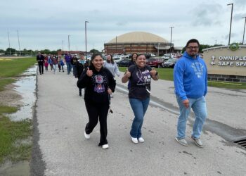 Community members walk to spread awareness on child abuse