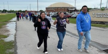 Community members walk to spread awareness on child abuse