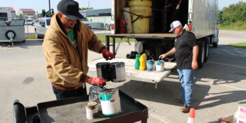 Community members responsibly recycle hazardous waste