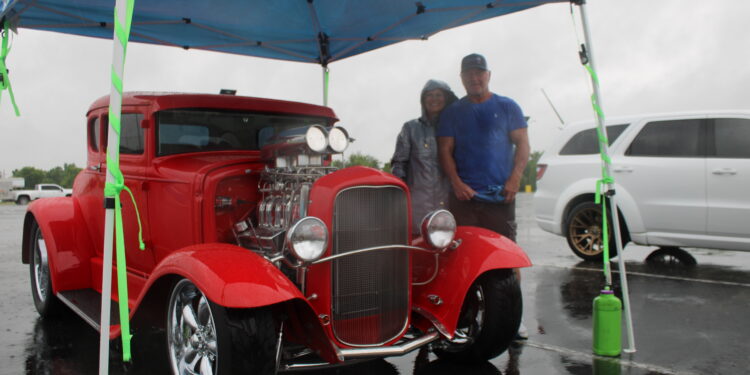 Festival cars rev in the rain